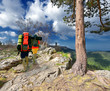 Tourists in the mountains with backpacks