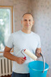 man with a paint roller