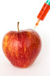 Red apple and syringes isolated on white