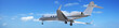 Private jet maneuvering in a blue sky. Panoramic composition.