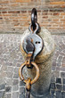 Ancient urban pillar to delimit the passage by chains