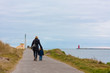 Mom and son strolling on the pier