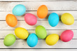 Photo: Easter eggs on a white wooden plank Easter eggs on a white wooden plank