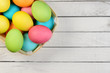Photo: Easter eggs on a white wooden plank Easter eggs on a white wooden plank