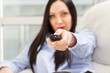 Attractive Woman with remote in her hands