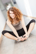 Young woman doing stretching exercise