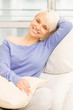 Pretty woman smiling on the sofa