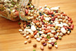 Photo: Dried Beans Spilling out of a Glass Jar Dried Beans Spilling out of a Glass Jar