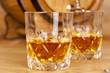 glass of whiskey and barrel