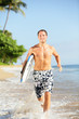 Beach lifestyle people - man surfer with surfboard