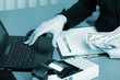 Human hands working on laptop on office background