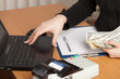 Human hands working on laptop on office background