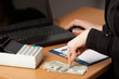 Human hands working on laptop on office background