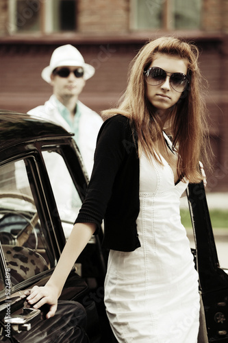 Photo: Young couple with retro car Young couple with retro car