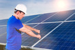 Photo: technician maintaining solar panels technician maintaining solar panels