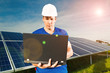 Green Energy - Solar panels with blue sky