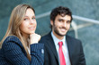 Two business people outdoor smiling 