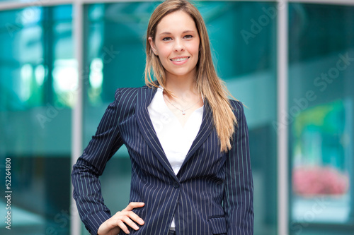 Photo: Beautiful businesswoman in an urban setting Beautiful businesswoman in an urban setting