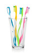 Photo: Colorful toothbrushes in glass Colorful toothbrushes in glass
