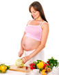 Foto: Pregnant woman preparing food . Pregnant woman preparing food .