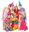 Birthday party group of child with cake.
