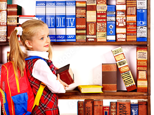 Photo: Child with stack book. Child with stack book.