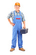 Full length portrait of a confident manual worker holding a tool