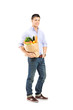 Full length portrait of a guy holding a shopping bag