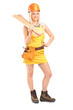 Full length portrait of a smiling female carpenter with helmet h