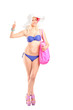 Full length portrait of an attractive blond woman in bikini givi