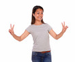 Photo: Ethnic young woman celebrating a victory Ethnic young woman celebrating a victory