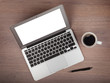 Laptop and coffee cup on wood table