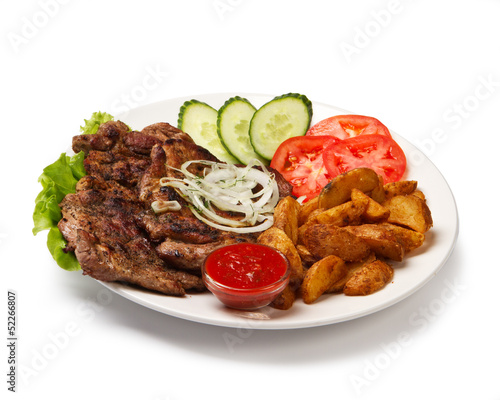 Photo: fried spare ribs with potatoes and vegetables fried spare ribs with potatoes and vegetables