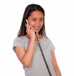 Photo: Asiatic charming young woman speaking on phone Asiatic charming young woman speaking on phone