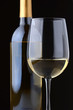 White wine glass and bottle