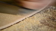 Close up of guitar wood when luthier give it wood planer.
