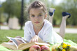 Photo: Portrait of beautiful little girl in spring blossom Portrait of beautiful little girl in spring blossom