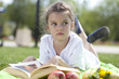 Photo: Portrait of beautiful little girl in spring blossom Portrait of beautiful little girl in spring blossom