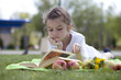 Photo: Portrait of beautiful little girl in spring blossom Portrait of beautiful little girl in spring blossom