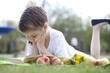 Photo: Portrait of beautiful little girl in spring blossom Portrait of beautiful little girl in spring blossom
