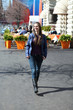 Beautiful young woman walking on the street