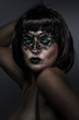 beautiful brunette with short hair and Venetian mask, cabaret