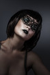 Doll, beautiful brunette with short hair and Venetian mask, caba