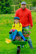 Gardening, planting - girl helping father in the garden