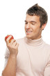 Photo: portrait of young man holding red apple portrait of young man holding red apple