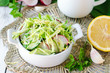 Salad from fresh cucumbers , radish and cabbage