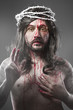 Photo: Jesus Christ with a halo of white light over grey background Jesus Christ with a halo of white light over grey background