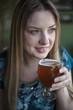 Photo: Blonde Woman with Beautiful Blue Eyes Drinks a Goblet of Beer Blonde Woman with Beautiful Blue Eyes Drinks a Goblet of Beer