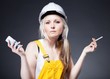 Confused architect woman holding cigarette and phone