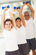 Photo: line up of family lifting dumbbells line up of family lifting dumbbells